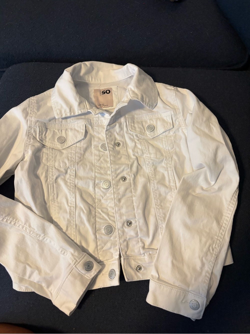 White Jean Jacket. Snap front. Chest pockets. Snap wrists. Girls size L 10/12